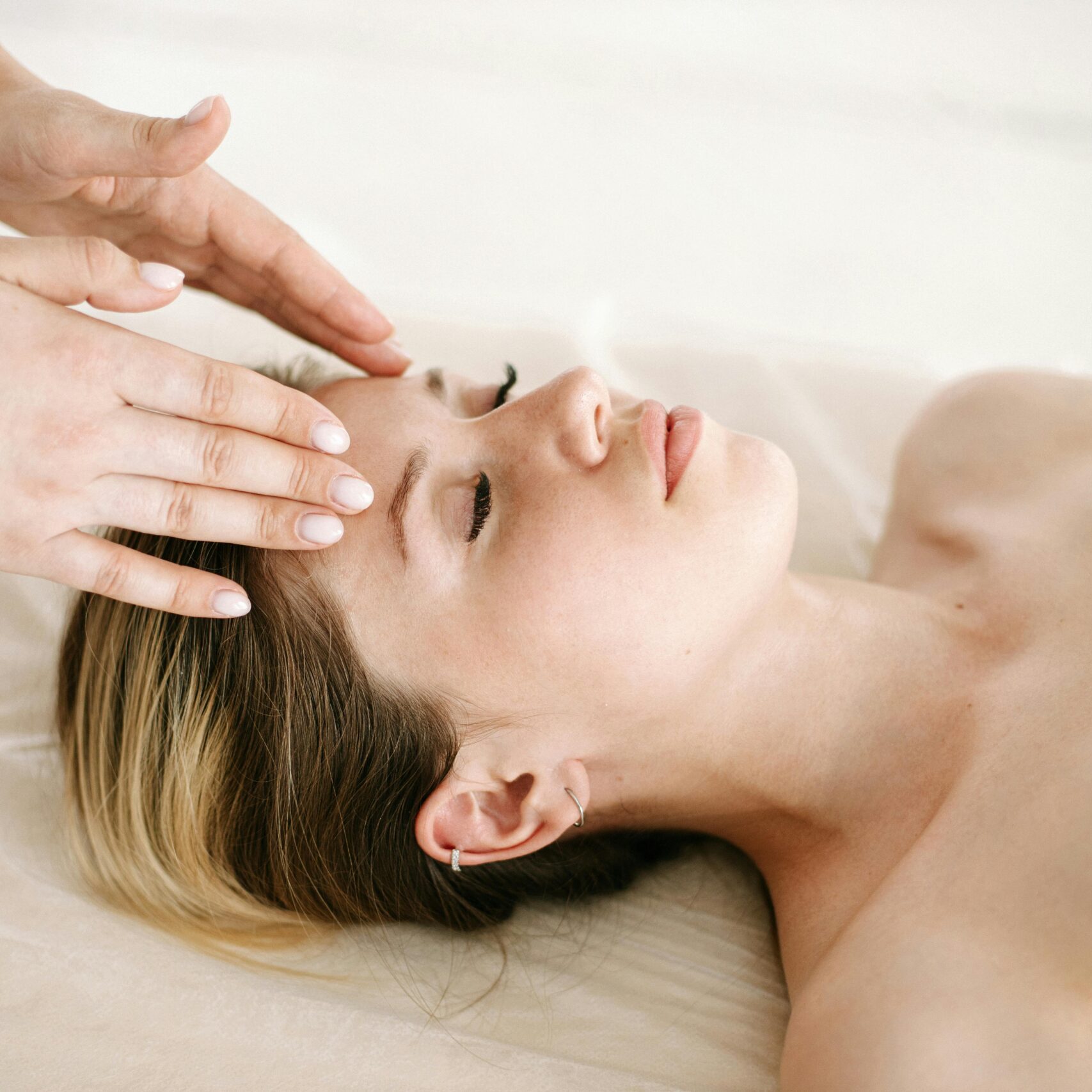 pexels-photo-5659014-5659014 A woman enjoying a relaxing face massage at a spa for therapeutic benefits.